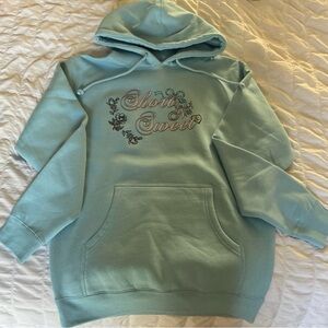 Blue Pullover Hoodie with Floral Design and Soft Texture